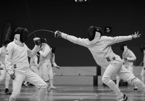 The Blade and the Strip: Why Ancient Sports Still Have Something Modern Life Doesn't